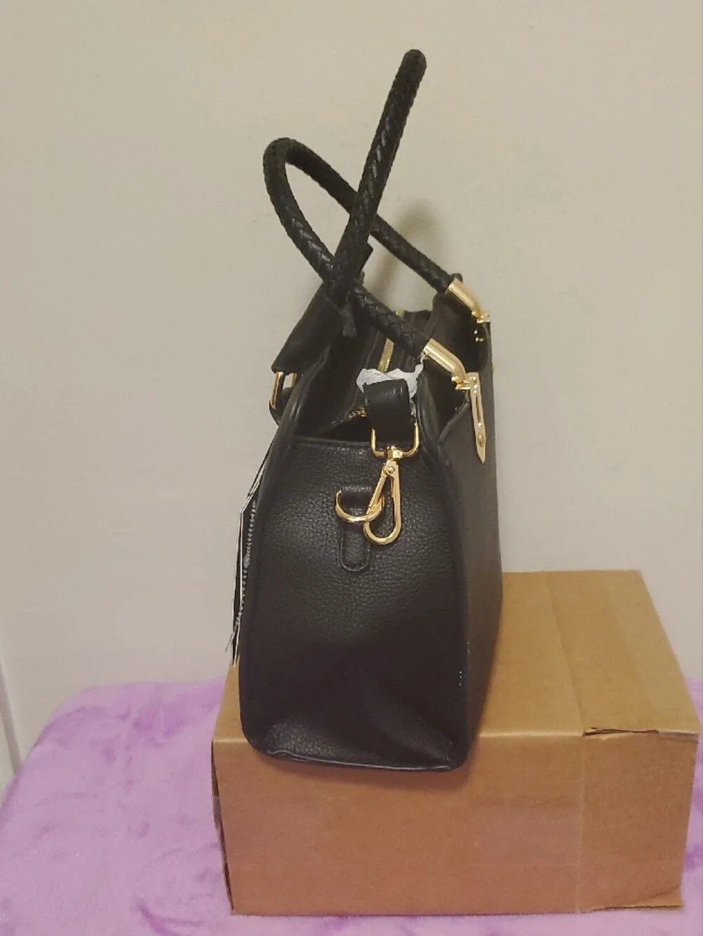 Structured Black Satchel with Braided Handles and Gold Accents